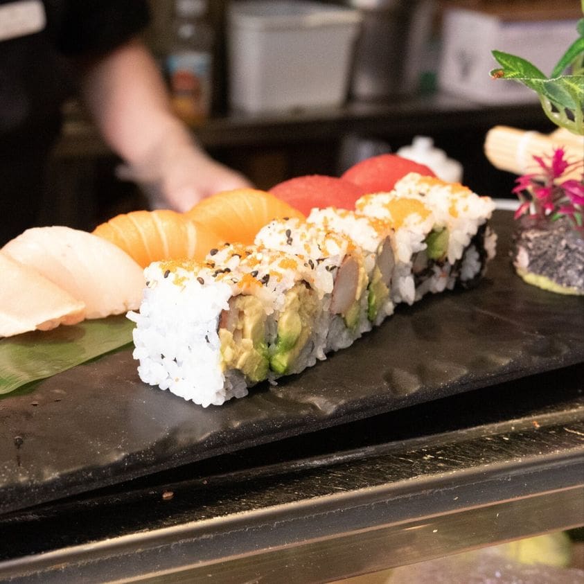 A sushi roll with many different types of vegetables.
